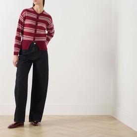 Model wearing Samsoe & Samsoe dry rose stripe mohair blend cardigan, styled with wide-leg black trousers and burgundy loafers.