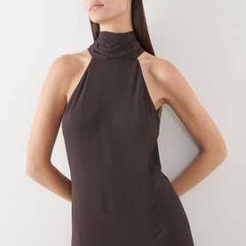 Model wearing Samsoe & Samsoe mulch halterneck dress in 100% viscose, featuring high neck and open back detail