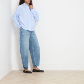 Model wearing Samsoe & Samsoe Sarita Striped Shirt in Windsurfer St with light blue jeans and black flat shoes