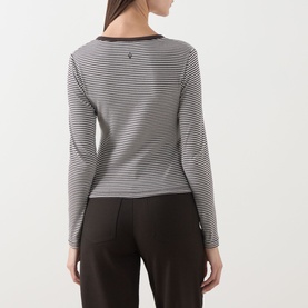 Model wearing Samsoe & Samsoe top in Mulch St. stripe, long-sleeve cotton stretch, shown from back with dark trousers