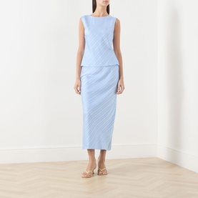 Model wearing Samsoe & Samsoe Saagne Tonal Striped Blouse in Windsurfer, styled with a matching blue midi skirt and nude heeled sandals.