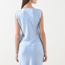 Model wearing Samsoe & Samsoe Saagne Tonal Striped Blouse in Windsurfer blue, sleeveless satin finish with diagonal stripe pattern, styled with