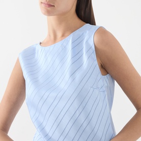Model wearing Samsoe & Samsoe Saagne Tonal Striped Blouse in Windsurfer, showing diagonal striped satin finish and sleeveless design at close crop.