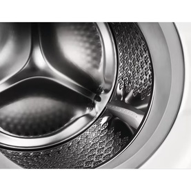 Electrolux Built In Washing Machine 8kg 1400 RPM white, close-up of stainless steel drum interior with paddle lifters