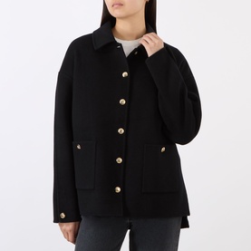 Model wearing Anine Bing black wool-cashmere jacket with gold buttons, collar, and front patch pockets