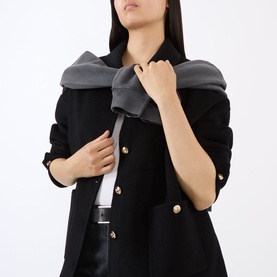 Model wearing Anine Bing black wool-cashmere jacket with gold buttons, styled with a grey scarf and white top with belt.
