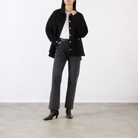 Model wearing Anine Bing black wool-cashmere jacket with gold buttons, styled with white tee, grey straight-leg jeans and black ankle boots.