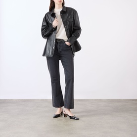 Model wearing Anine Bing Lee Cashmere Sweater in cream, styled with black leather jacket, dark grey jeans and black slingback heels
