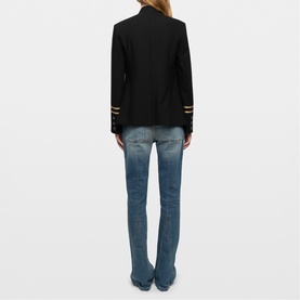 Model wearing Zadig black blazer with gold stripe cuff detail, styled with mid-wash blue flared jeans, rear view