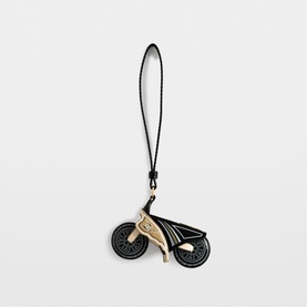 Zadig black leather bicycle charm with gold-tone hardware and wrist strap, decorative wheel detail