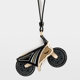 Zadig black and gold motorcycle charm pendant on black cord, enamel detail, flat silhouette design
