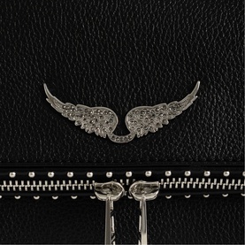 Zadig black leather bag close-up showing silver crystal angel wings embellishment and studded zip detail