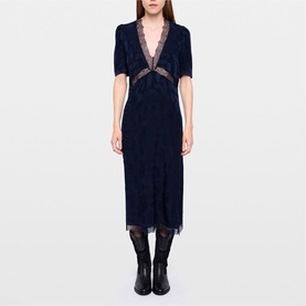 Model wearing Zadig black lace midi dress with deep V-neckline, lace trim detail, styled with black tights and ankle boots