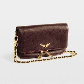 Zadig purple grained leather clutch bag with gold chain strap and signature wing hardware detail on flap closure