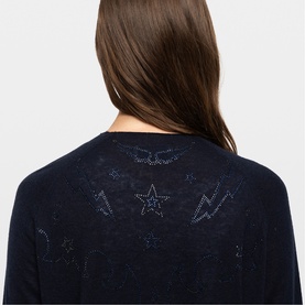 Model wearing Zadig blue knit top, back view showing crystal star, lightning bolt and wing embellishments