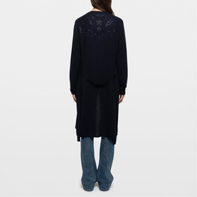 Model wearing Zadig blue longline open-front cardigan with lace upper back detail, styled with wide-leg jeans, rear view