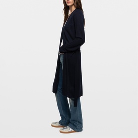 Model wearing Zadig blue longline open-front cardigan with tie waist, styled with wide-leg jeans and silver trainers