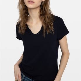 Model wearing Zadig blue short sleeve V-neck T-shirt with button detail, styled with denim jeans