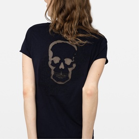 Model wearing Zadig blue T-shirt, back view featuring large tonal skull graphic print.