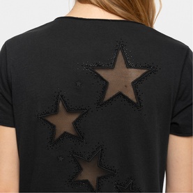 Model wearing Zadig green top, back view with sheer mesh star appliqu&eacute;s outlined in beaded embellishment detail