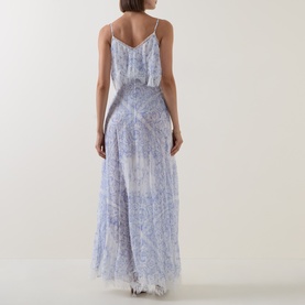 Model wearing LOVESHACKFANCY Indigo Shores silk maxi dress, back view, floral print, ruffle overlay bodice and spaghetti straps