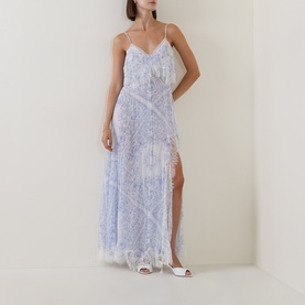Model wearing LOVESHACKFANCY Dress in Indigo Shores, a floral silk maxi slip dress with spaghetti straps, lace trim, and side split.