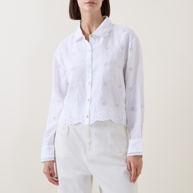 Model wearing LoveShackFancy Optic White linen shirt with broderie anglaise embroidery, scalloped hem, and button-front fastening