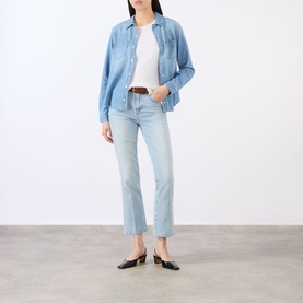 Model wearing LAgence blue cotton shirt, styled with light wash cropped flare jeans, white tee, brown belt and black ballet flats