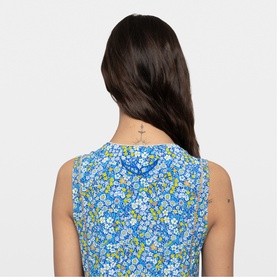Model wearing Zadig yellow floral sleeveless top, close-up of back detail showing ditsy blue and yellow flower print