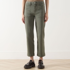 Model wearing Paige Quincy Ankle Straight-Leg Jeans in Vintage Ivy Green, mid-rise with front patch pockets, styled with dark loafers.