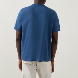 Model wearing Paul Smith Crew Neck T in Indigo, back view, relaxed fit in 100% cotton, styled with cream trousers