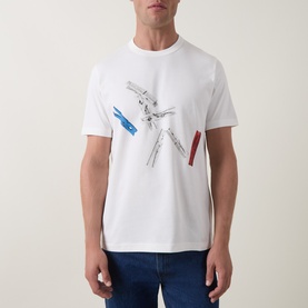 Model wearing Paul Smith Off White Crew Neck T-shirt with multicolour clothespeg graphic print, styled with dark blue jeans.