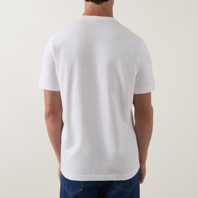 Model wearing Paul Smith Crew Neck T in off white, rear view, styled with blue denim jeans