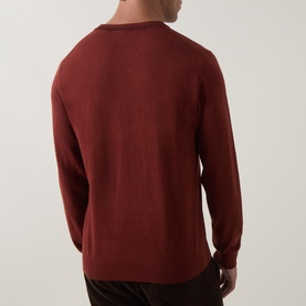 Model wearing Paul Smith Brick Red 100% cotton crew neck jumper, shown from the back with a clean, minimal finish.