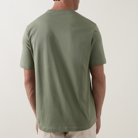 Model wearing Paul Smith Crew Neck T in light grey green, rear view, relaxed fit, 100% cotton, styled with stone chinos.