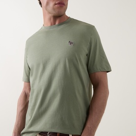 Model wearing Paul Smith Crew Neck T-Shirt in light grey green with embroidered zebra logo at chest.