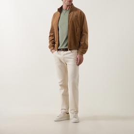 Model wearing Paul Smith Light Grey Green Crew Neck T-shirt, styled with tan suede bomber jacket, cream trousers and white trainers.