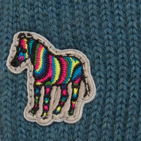 Paul Smith Access blue wool gloves detail showing multicolour zebra embroidered patch on ribbed knit fabric