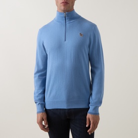 Model wearing Paul Smith Light Blue cotton half-zip knit jumper with signature multicolour zebra logo badge on chest.