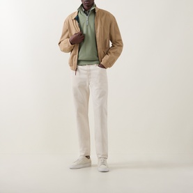 Model wearing Paul Smith Light Grey/Green cotton half zip, styled with a camel harrington jacket, off-white trousers and white trainers.