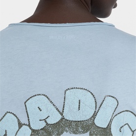 Model wearing Zadig blue T-shirt, back view showing embellished graphic lettering detail at hem