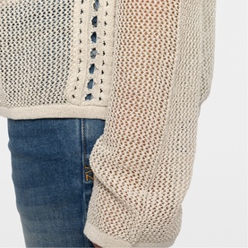 Model wearing Zadig beige open-knit mesh jumper with blue jeans, close-up of sleeve and body detail
