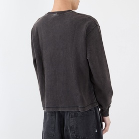 Model wearing Almost Home Porto Black long-sleeve cotton T-shirt, rear view, with black trousers