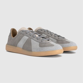 Adidas grey suede low-top trainers with white side stripe, lace-up fastening, and gum rubber sole