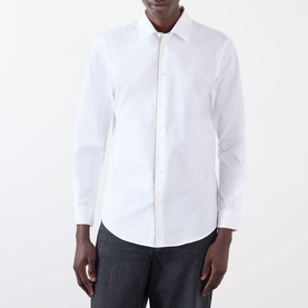 Model wearing Burberry Sam Logo Check Trim Casual Shirt in Optic White, long sleeves, button front, point collar, styled with grey trousers.