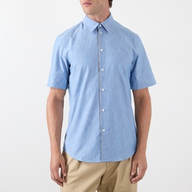 Model wearing Burberry Sam Check Trim Shirt in Stoke Blue Melange, short sleeves, point collar, check trim detail, styled with beige chinos
