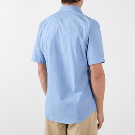 Model wearing Burberry Sam Check Trim Shirt in Stoke Blue Melange, short sleeves, back view, styled with beige chinos.