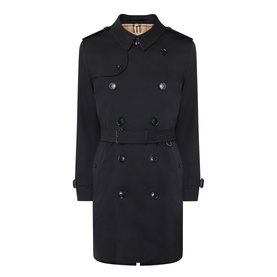 Burberry Kensington Heritage Trench Coat in black, double-breasted with epaulettes, belted waist, tabbed cuffs, and iconic check lining visible at