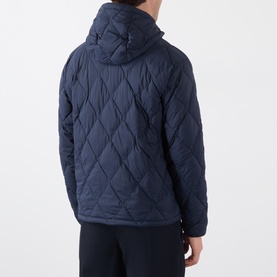 Model wearing Burberry navy quilted hooded jacket, rear view, shown with matching navy trousers