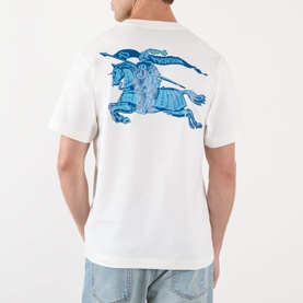 Model wearing Burberry white cotton T-shirt, back view showing large blue Equestrian Knight graphic print, styled with light blue jeans.